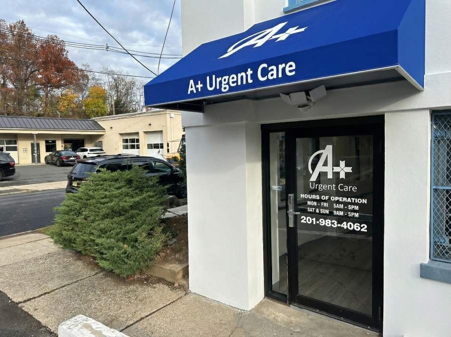 A+ Urgent Care Bloomfield NJ front entrance with blue awning, clinic signage, hours of operation, and nearby parking