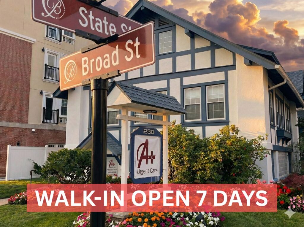 Exterior of the A+ Urgent Care walk-in clinic at the corner of State Street and Broad Street in Bloomfield, with a banner that reads "Walk-In Open 7 Days."