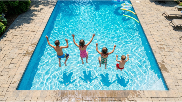 Kids enjoying the summer jumping in the pool